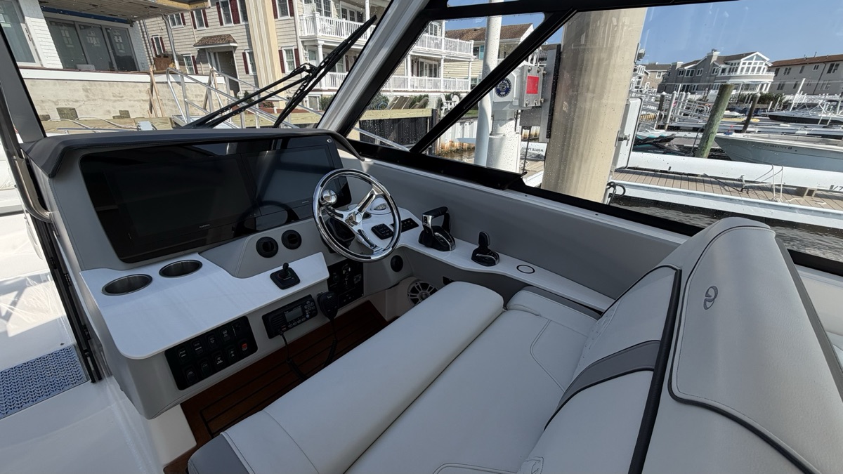A helm after detailing: screen, wheel and console wiped clean.